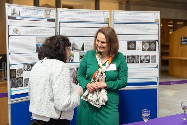 Researchers presenting MND research.
